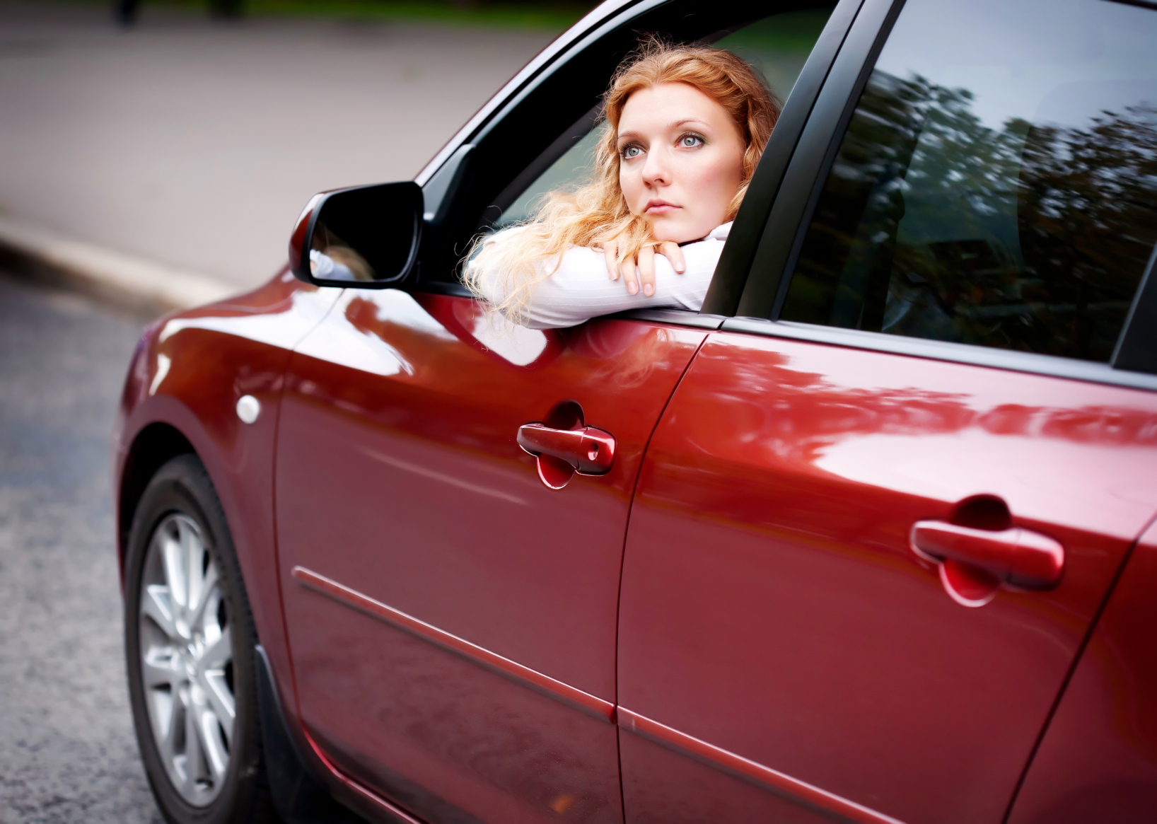 woman in car ready for driving lesson